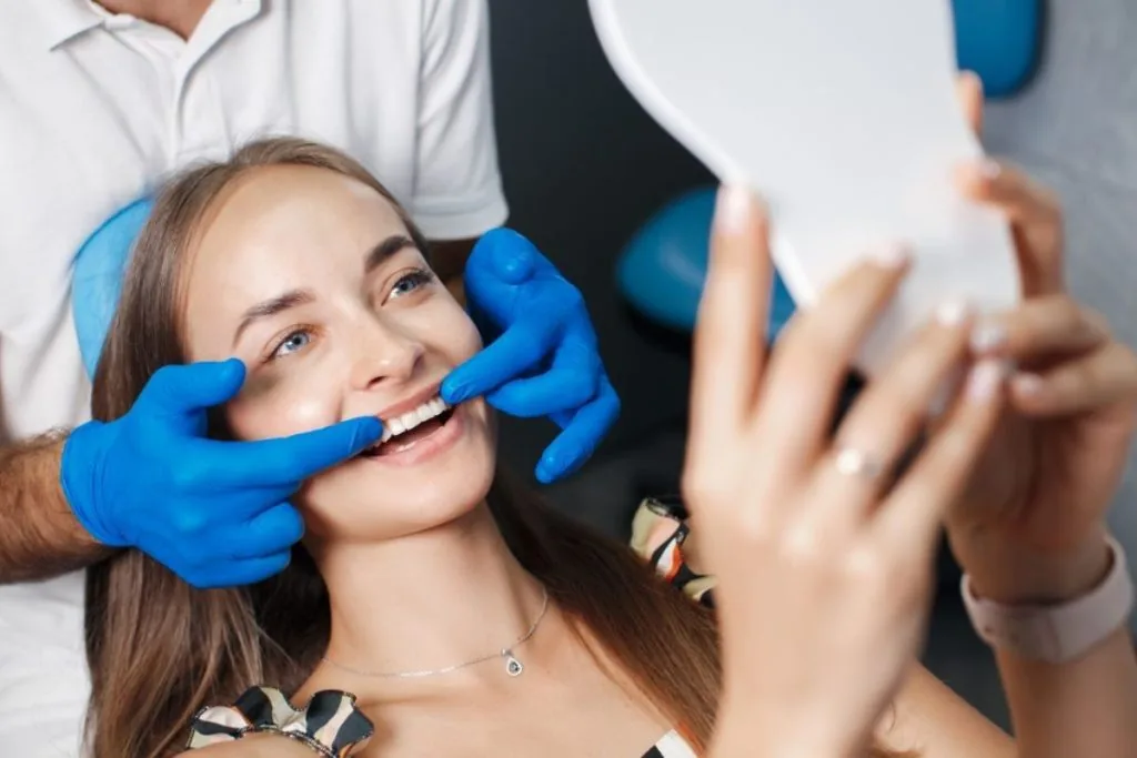 patient receiving tooth bonding treatment for repairing chipped and discolored teeth