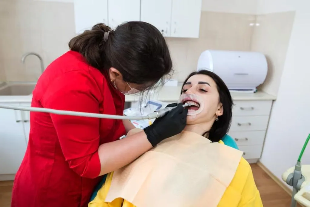 patient receiving professional dental checkup and teeth cleaning for better oral health