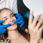 patient receiving tooth bonding treatment for repairing chipped and discolored teeth
